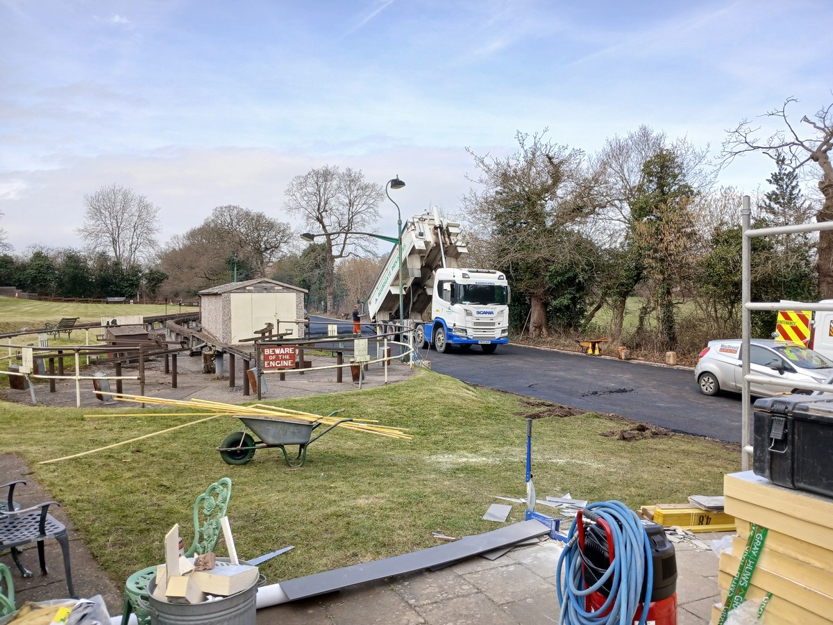 The first of the wagons delivering the tarmac